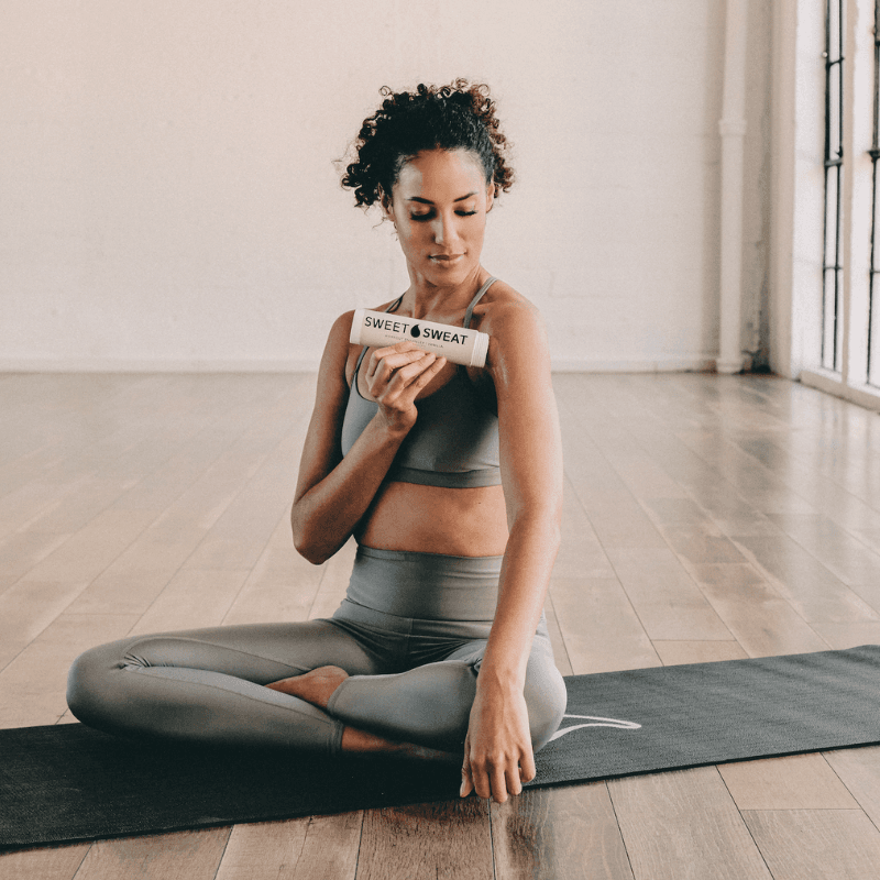 Women on Yoga Mat with Sweet Sweat